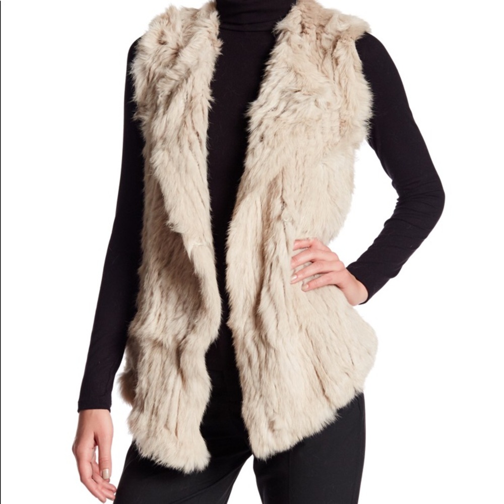 A DOLCE CABO that is a vest which is size medium